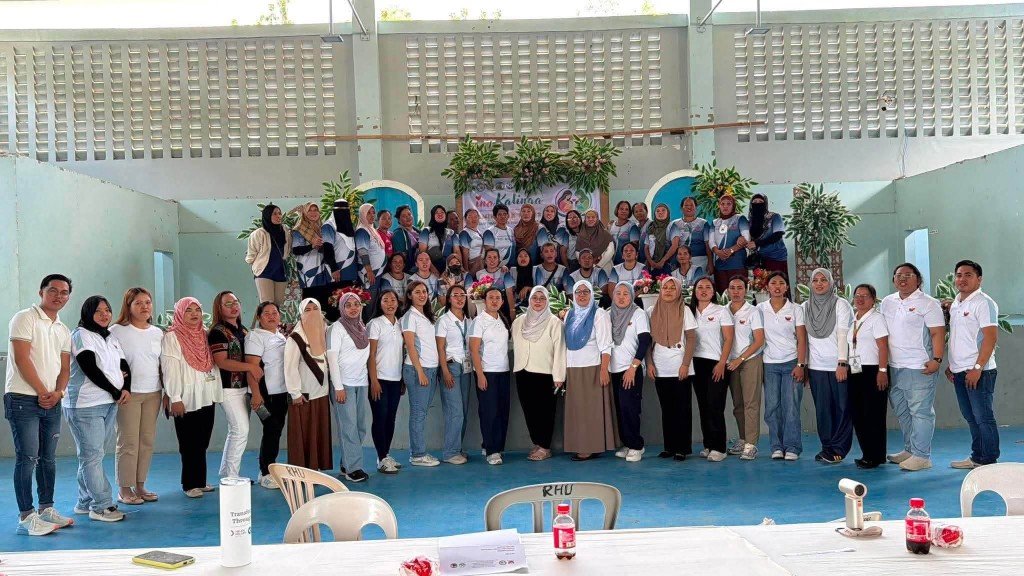 RHU and community health workers gathered for a program